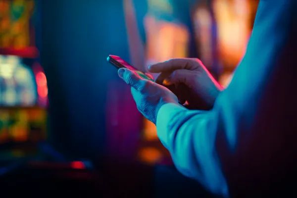 A woman in a luxurious green gown next to an ornate roulette wheel, capturing the upscale casino mood of D63.